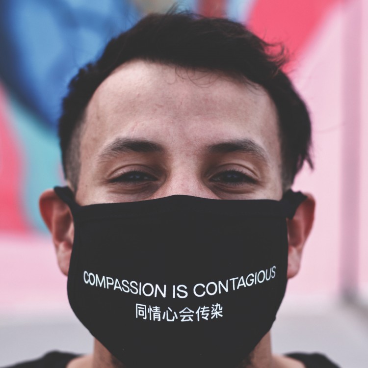Compassion is contagious face mask